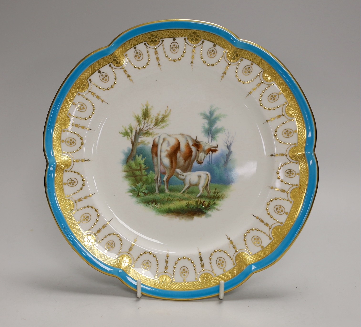 A Minton plate with turquoise, acid etched and raised gilt border painted with a cow and a sheep by Henry Mitchell, 24cm